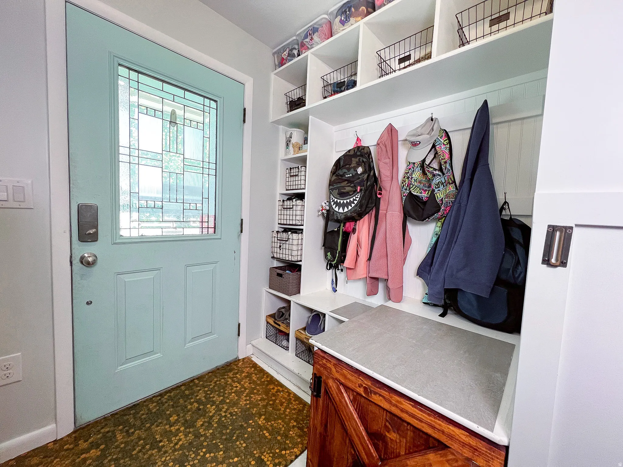 Frosted glass paneled entry door with smart lock