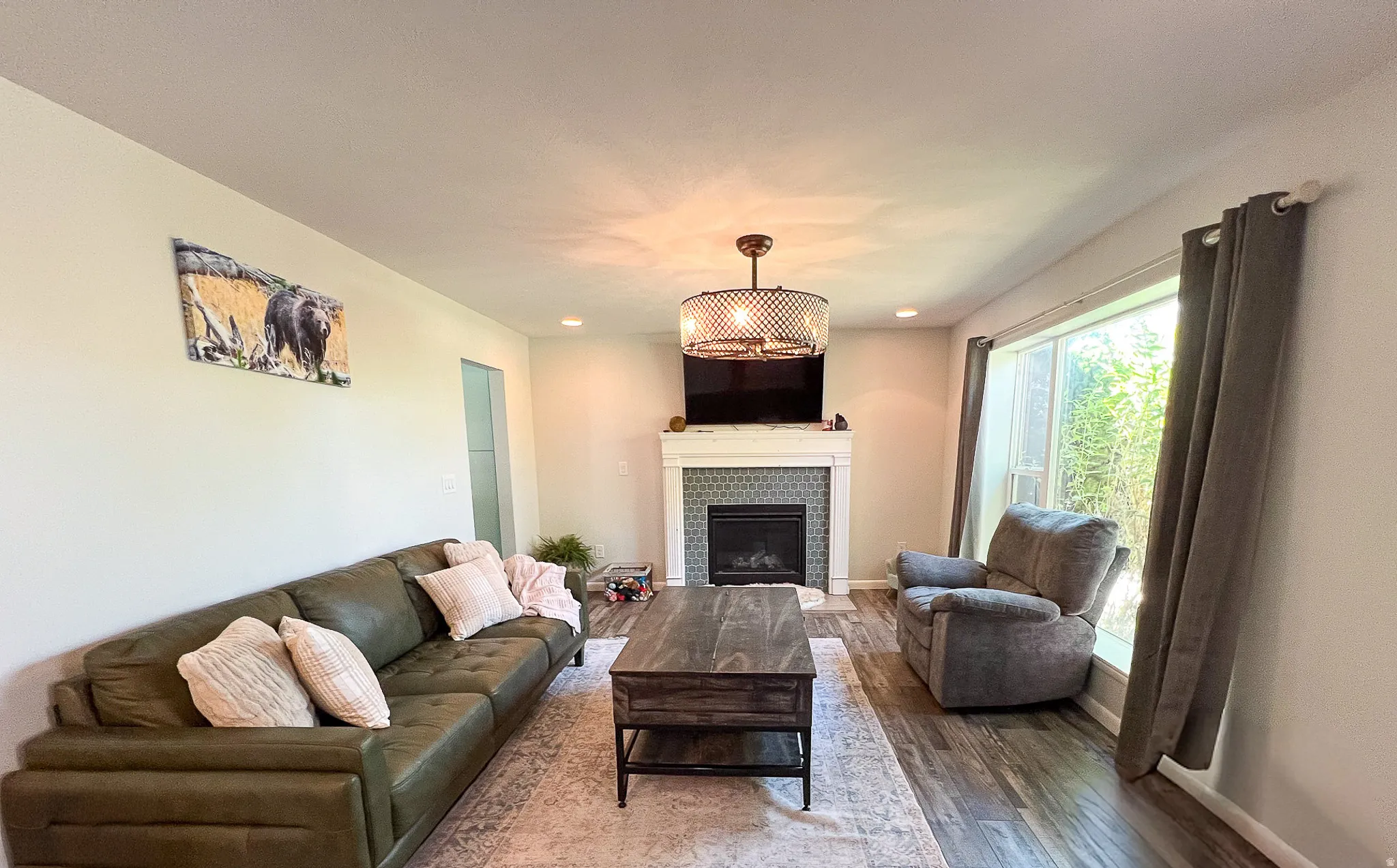 Fireplace with a patterned tile surround and a white mantel