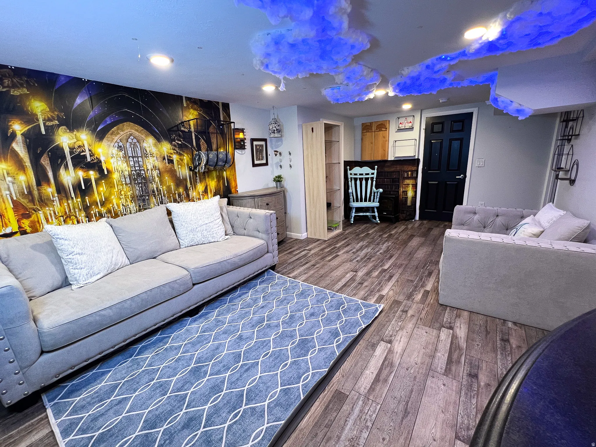 Recessed ceiling lighting illuminates wood-finish flooring