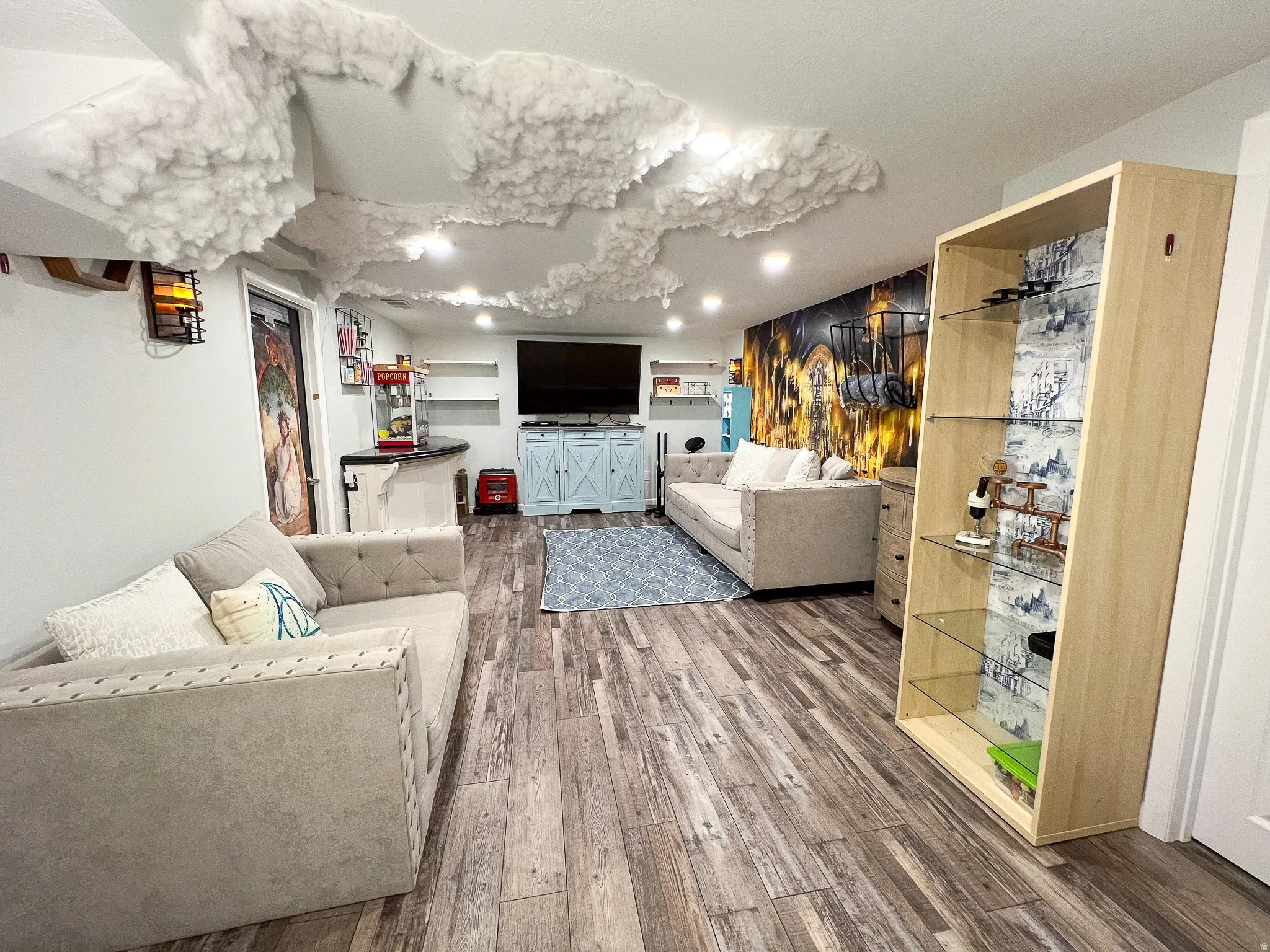 Recessed lighting illuminates the wood-finish flooring