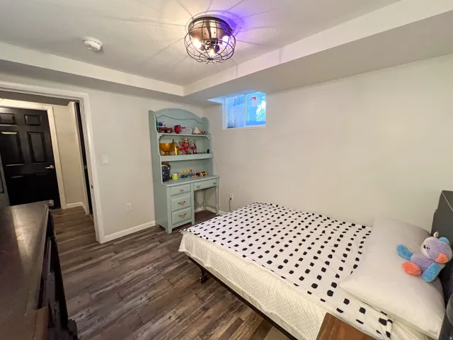 Wood-finish flooring, recessed ceiling, and a built-in window