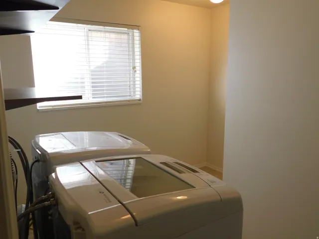 Recessed lighting and a window with horizontal blinds