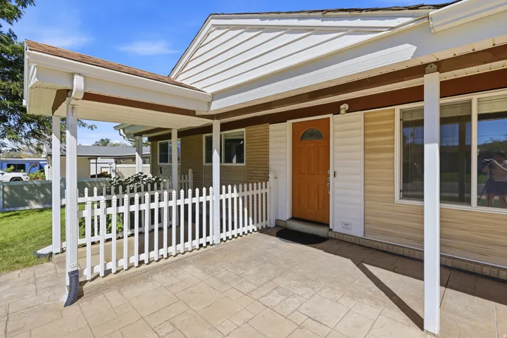 Covered porch with stamped concrete patio