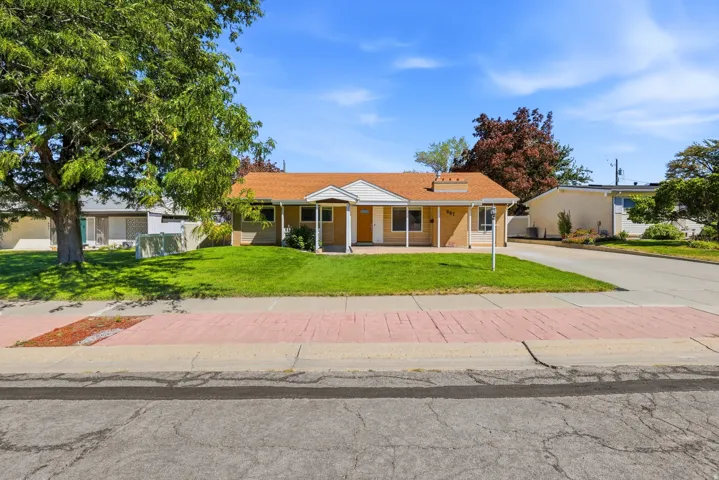 Single-story residence featuring a covered front porch, a gabled entry, and a pitched roof
