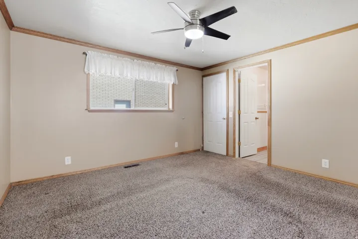 Wall-to-wall carpeting and neutral wall tones