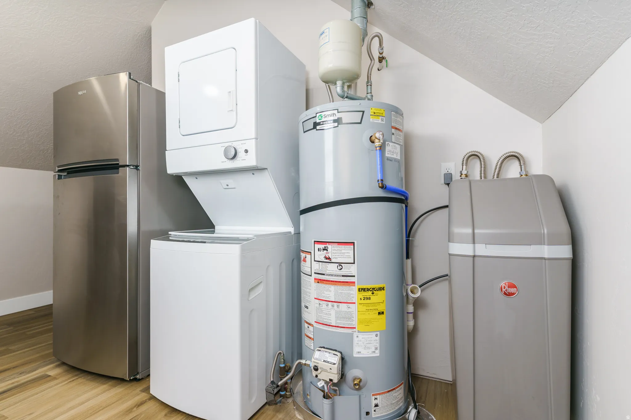 Stainless steel refrigerator, stackable washer and dryer, water heater, and water softener system