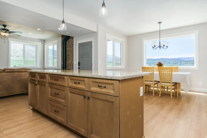 Kitchen island with light-toned cabinetry and a light-colored countertop