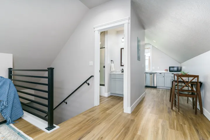 Light wood-finish flooring extending through the space