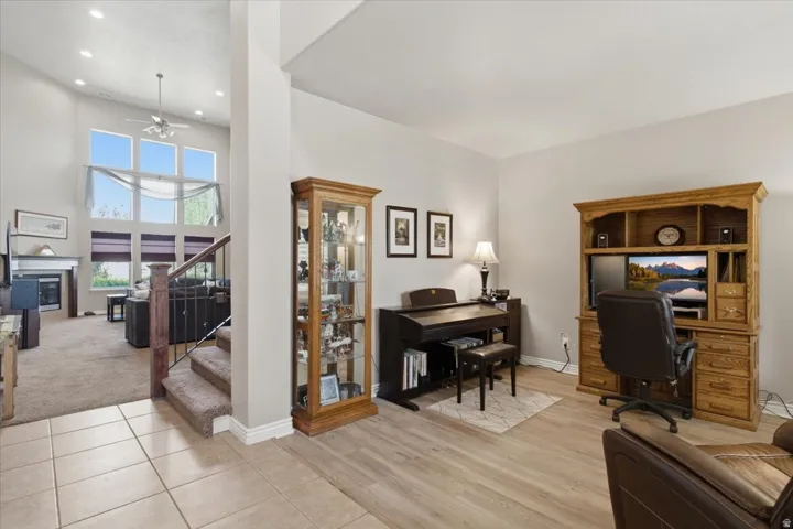 Open-concept living area with soaring ceilings and large windows