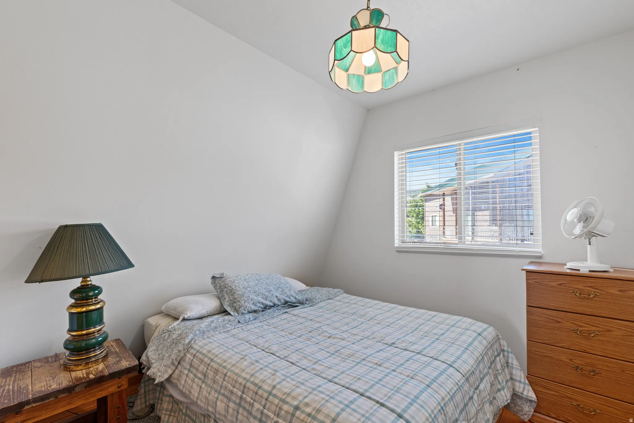 White walls with an angled ceiling detail