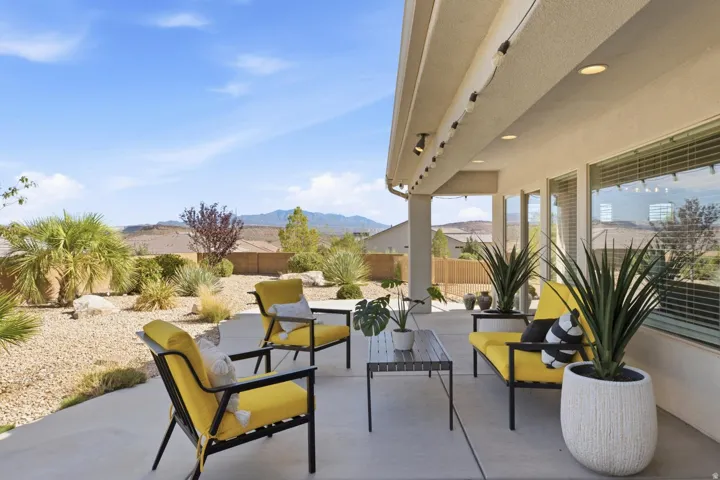 Covered patio with recessed lighting, track lighting, and concrete flooring