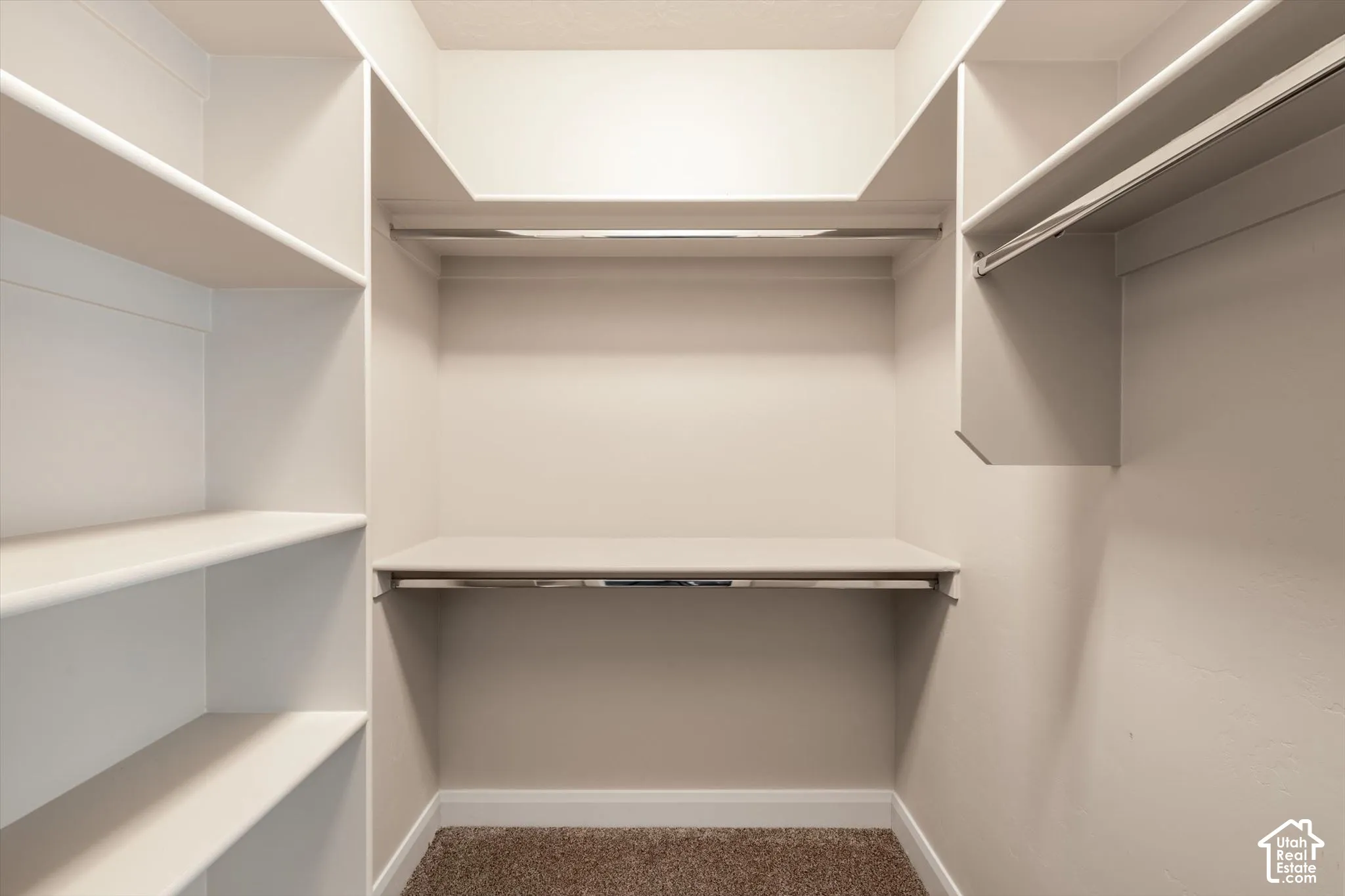 Built-in closet shelving system with multiple shelves and hanging rods