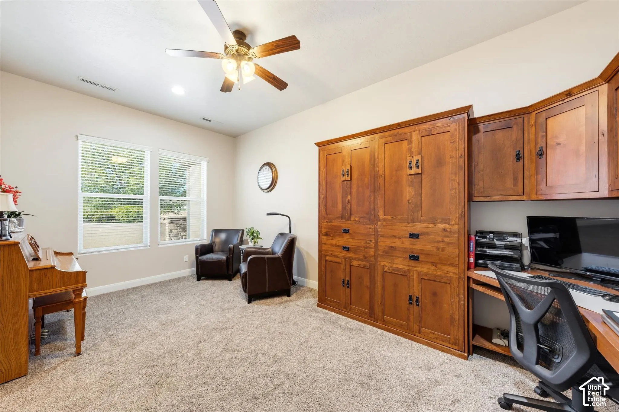 Built-in wood cabinetry with integrated desk