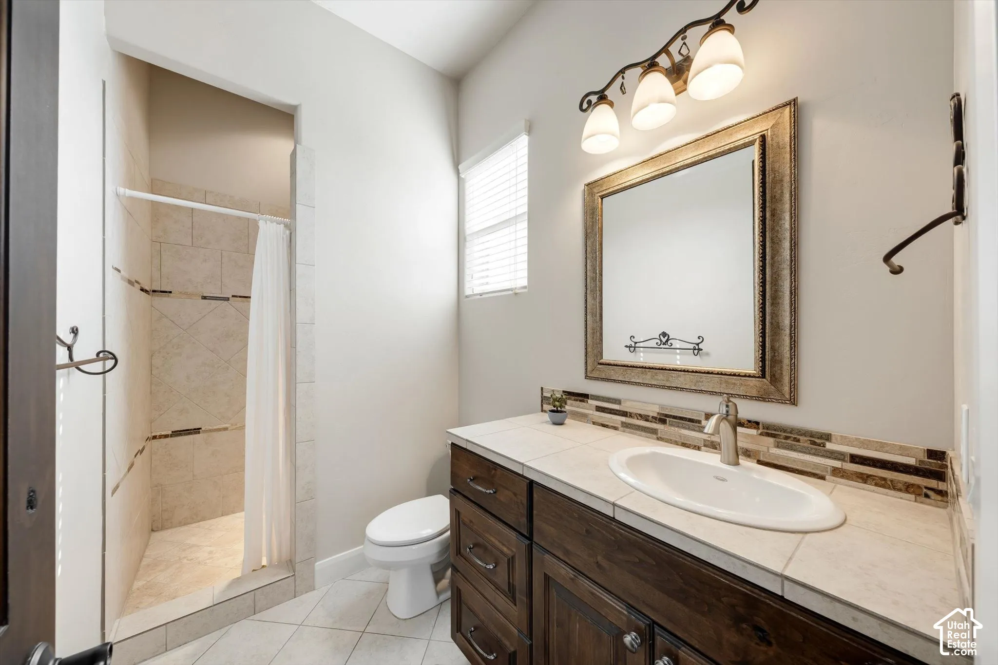 Shower with tile surround and decorative accent band