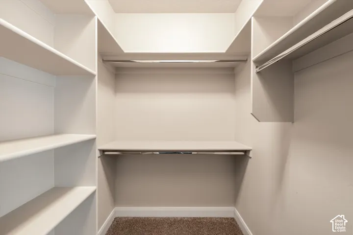 Built-in closet shelving system with multiple shelves and hanging rods
