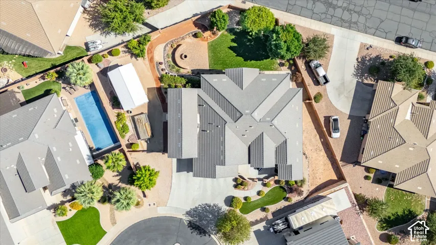Extensive property featuring a swimming pool, multiple driveways, and a putting green