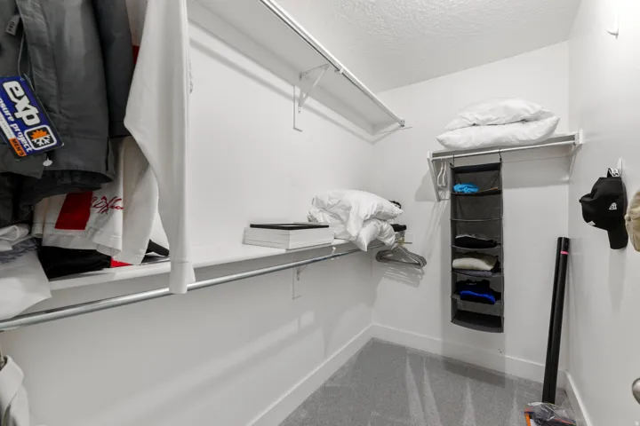 White painted walls, white ceiling, and gray carpet