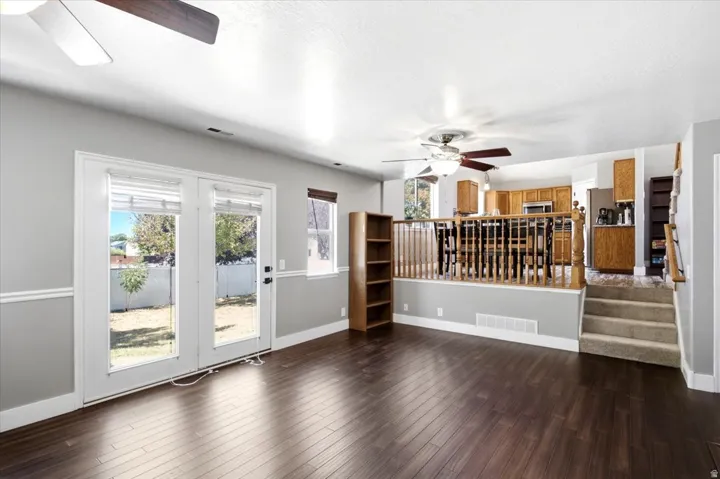 Wood-finish flooring throughout, with a neutral wall palette