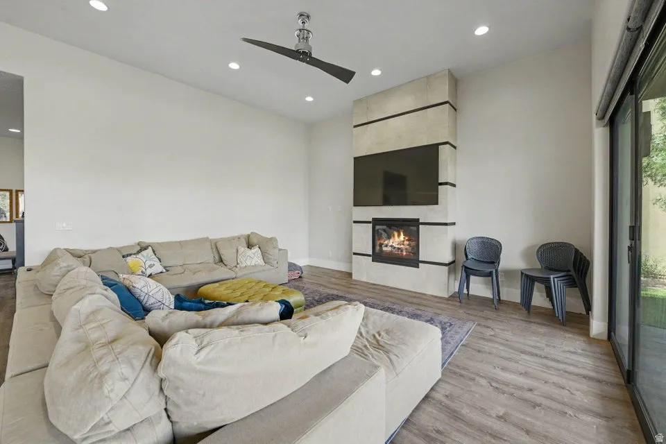 Wood-finish flooring, recessed lighting, and a modern ceiling fan