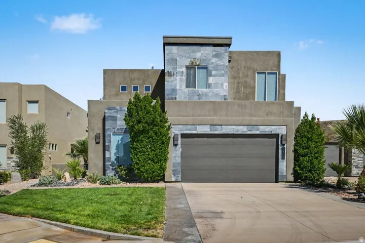 Contemporary architecture with stucco and stone veneer exterior
