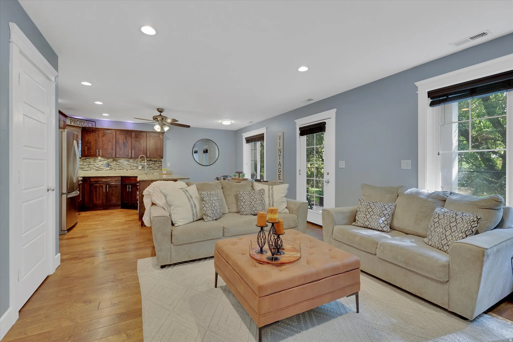 Hardwood flooring, recessed lighting, and a ceiling fan with light kit