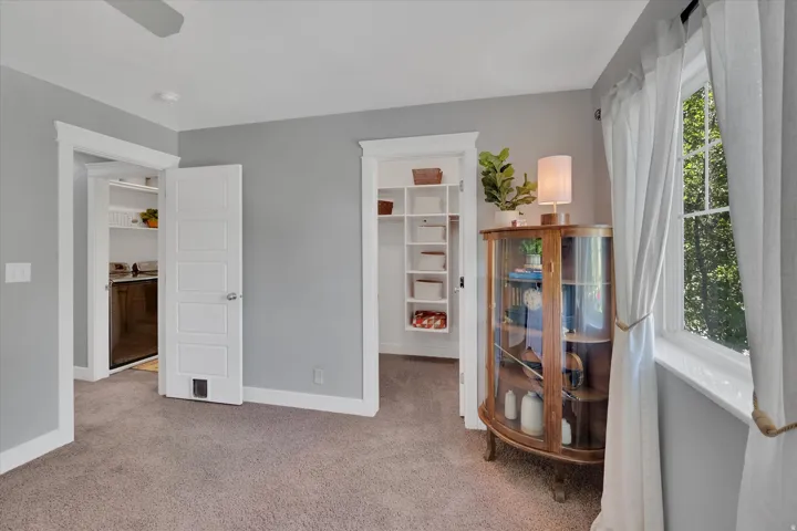 Wall-to-wall carpeting and neutral wall tones