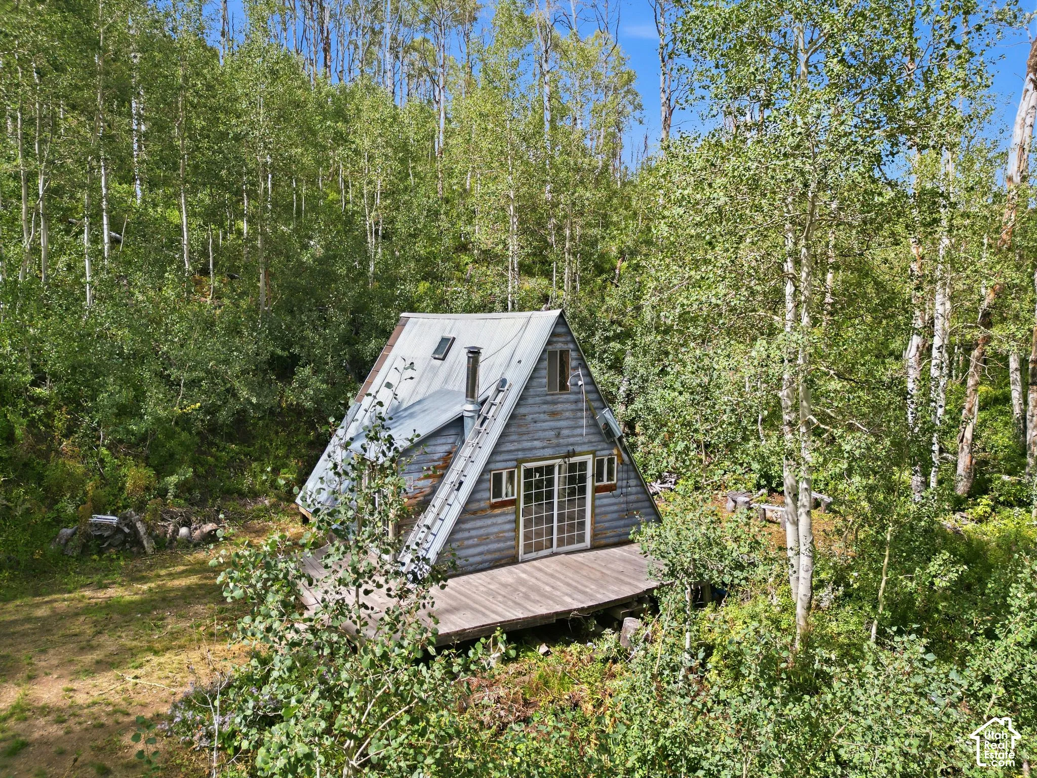 A-frame structure with a metal roof and skylight