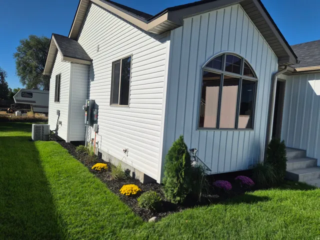 White horizontal siding exterior with a pitched roof