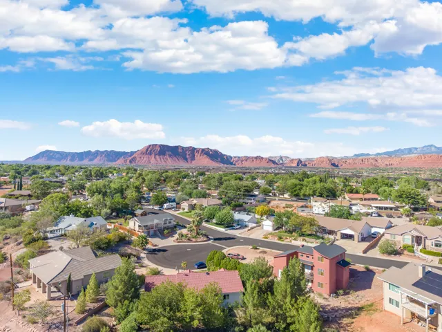 Expansive mountain backdrop with a residential setting