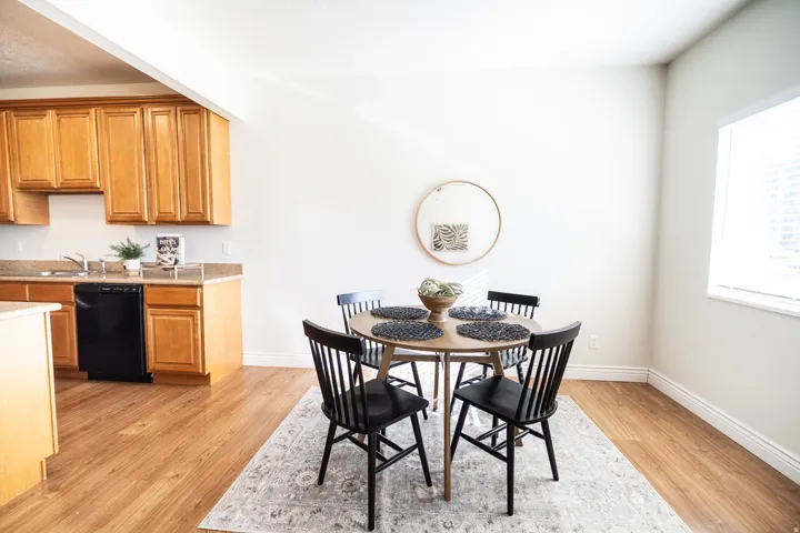 Kitchen with wood-finish cabinetry and light-toned countertops