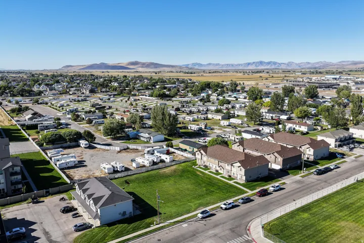 Expansive open land area with clear mountain backdrop