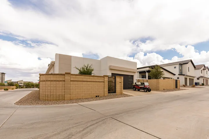 Modern architectural design featuring a smooth stucco exterior and a flat roofline