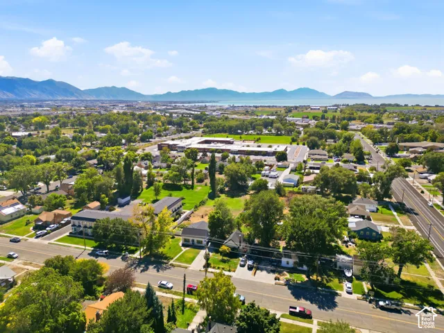 Expansive neighborhood with abundant mature trees and distant mountain ranges