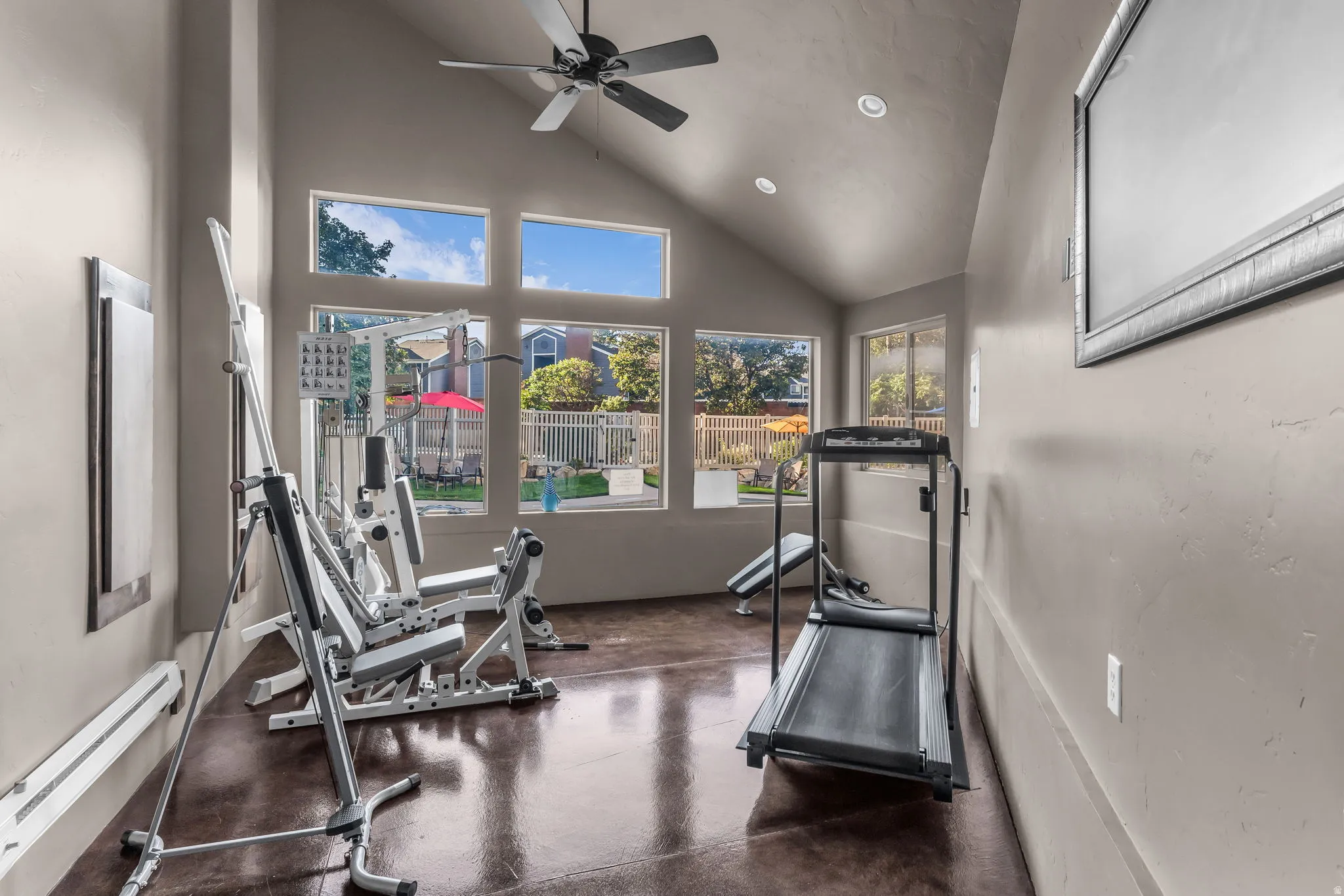 Vaulted ceiling with a ceiling fan and recessed lighting