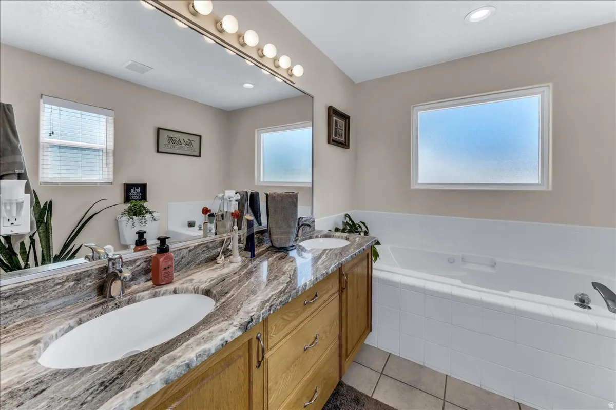 Dual vanity with integrated sinks and a stone-finish countertop