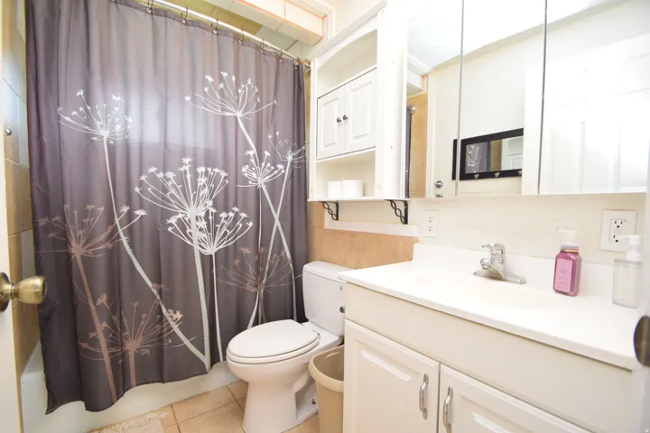 White vanity with an integrated sink and chrome faucet