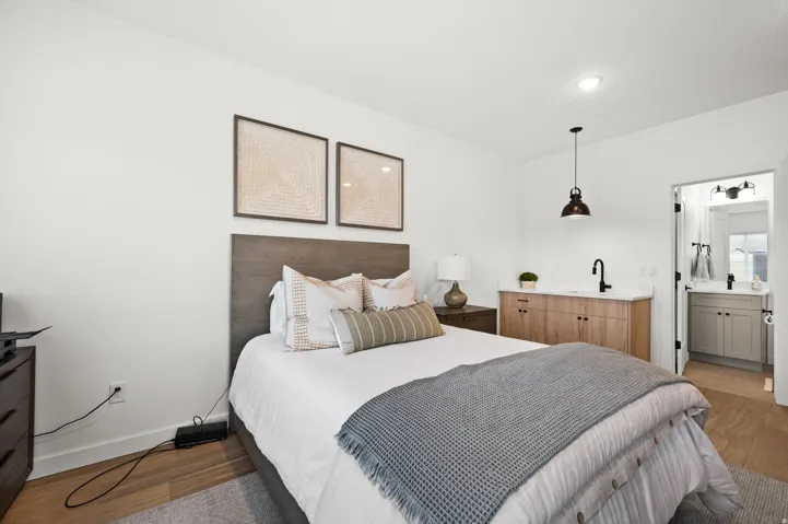 Wood-finish flooring with a light tone, recessed ceiling lighting, and a white ceiling