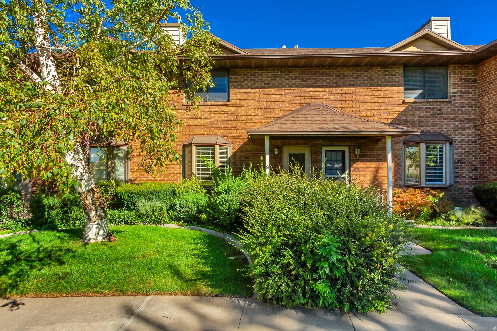 Brick exterior facade with a covered entry