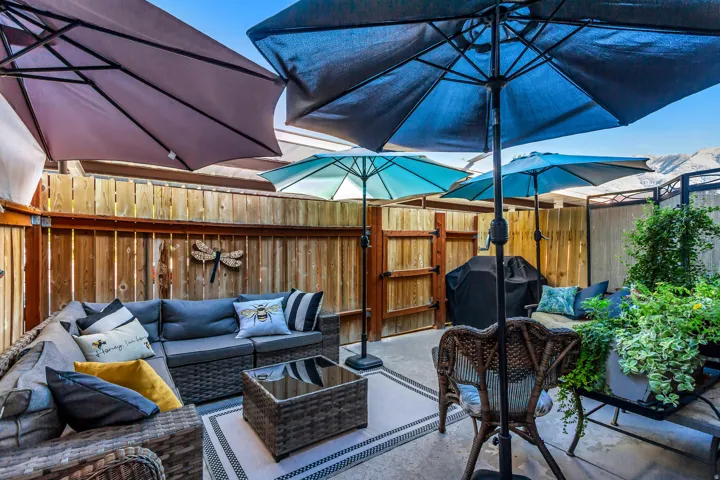 Fenced outdoor patio with a concrete surface