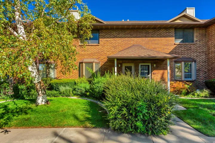 Brick exterior facade with a covered entry