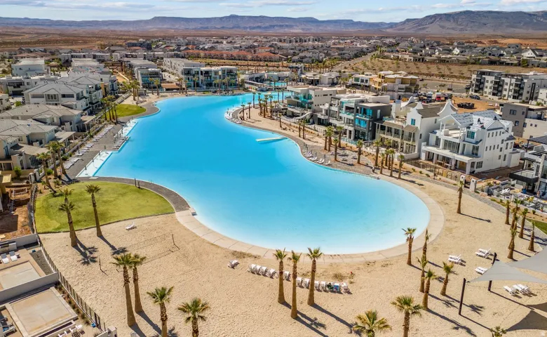 Expansive community featuring a large, irregular-shaped lagoon with sandy shores