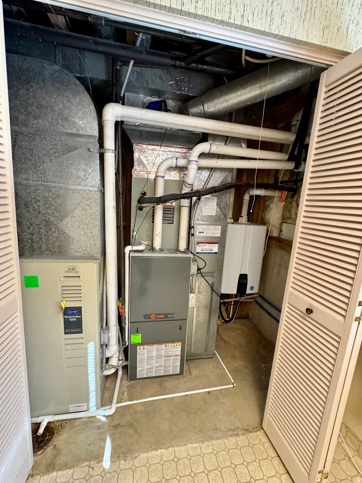 HVAC system, water heater, and utility access in a dedicated closet