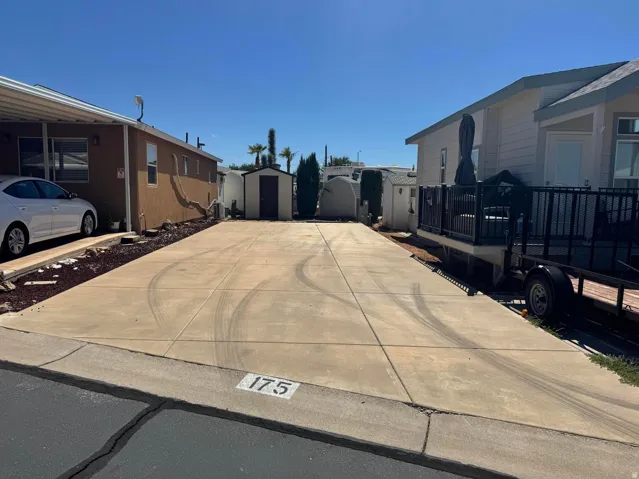 Concrete driveway with marked street number 175