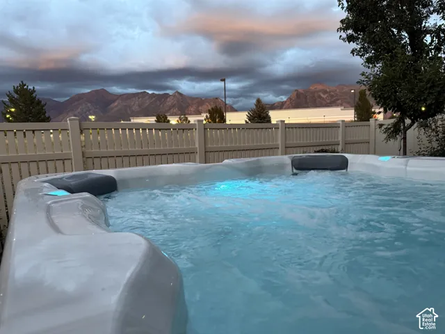 Spa with integrated lighting and surrounding privacy fencing
