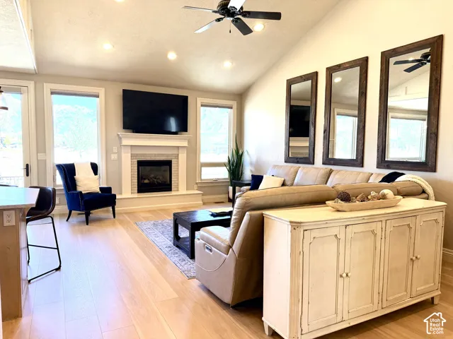 Vaulted ceiling with recessed lighting and ceiling fan