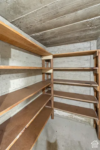 Concrete walls with built-in wooden shelving
