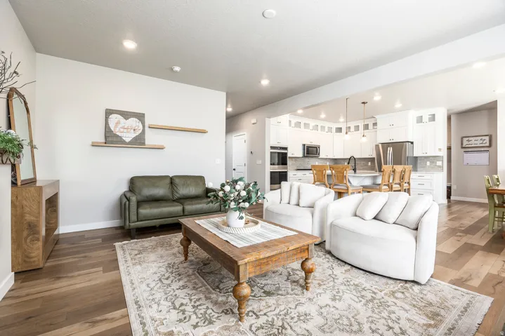 Wood-finish flooring, recessed lighting, and an open-concept layout
