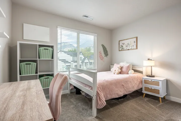 Window featuring horizontal blinds, neutral wall paint, and gray carpet flooring
