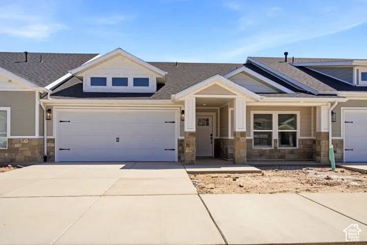 Contemporary exterior with stone veneer and horizontal siding