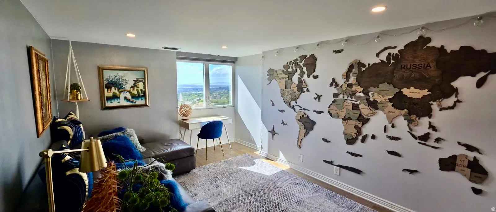 Recessed ceiling lighting, wood-finish flooring, and a large window